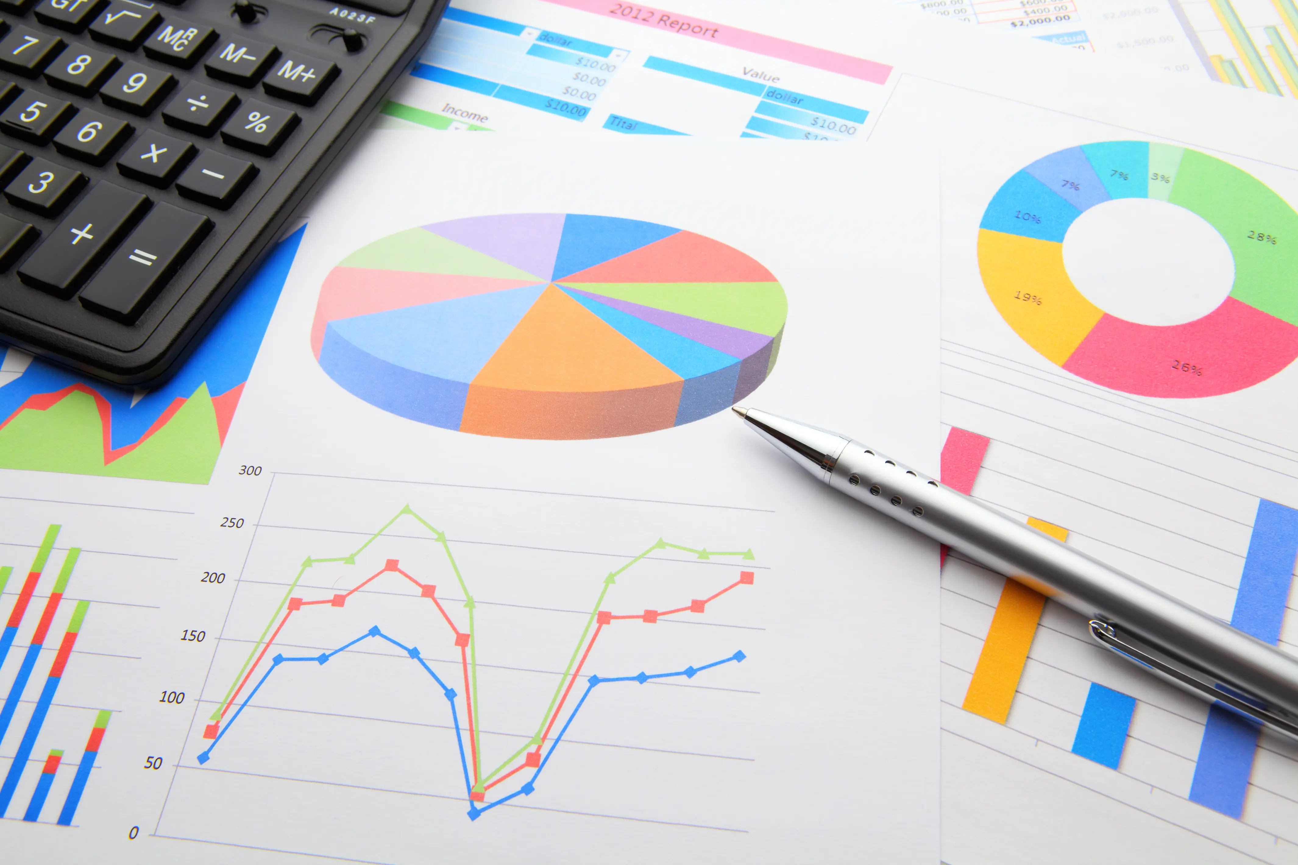 Infographic of a table covered with colourful graphs and a pie chart