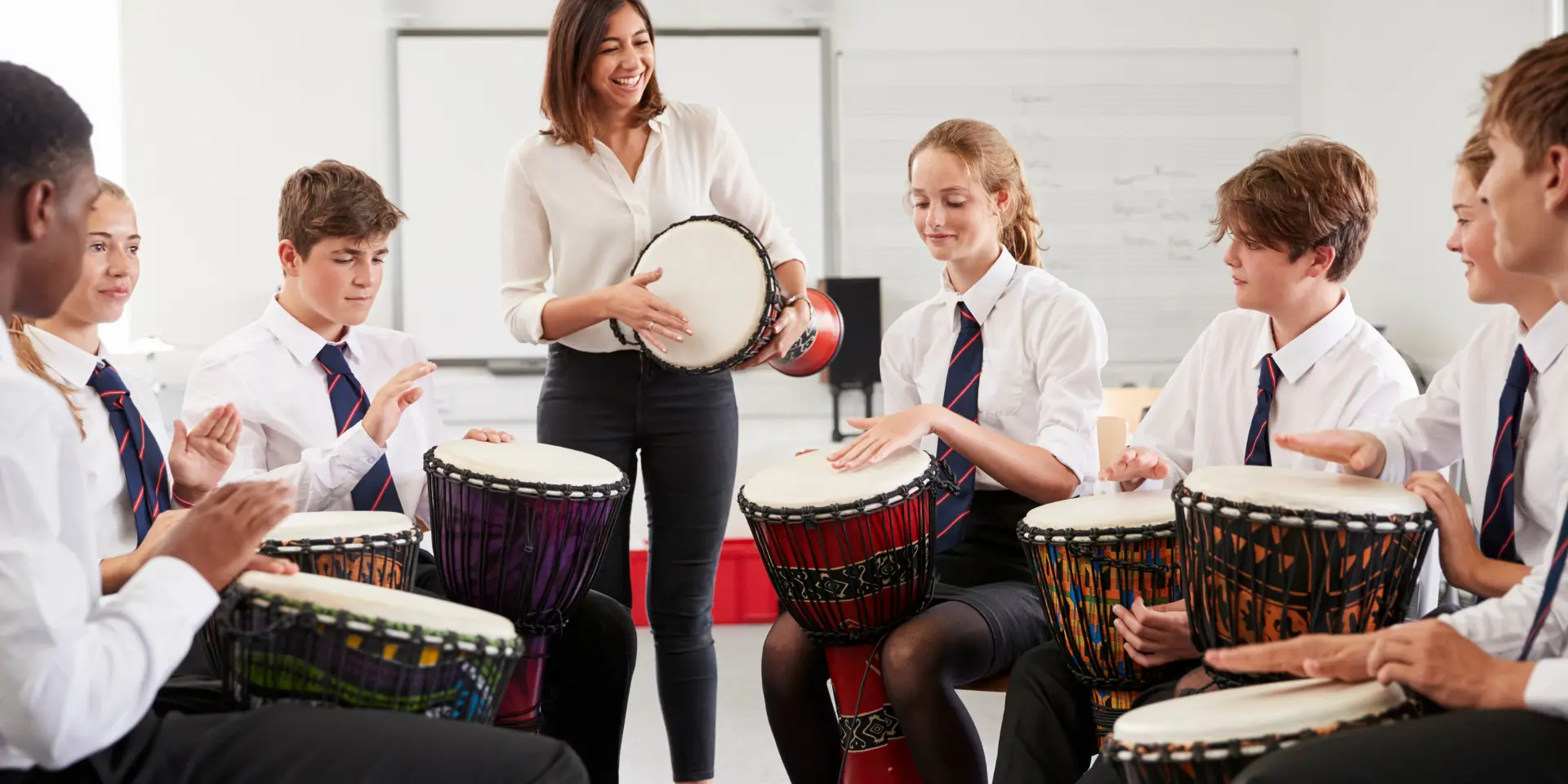 Teenage Students Studying Percussion In Music Class