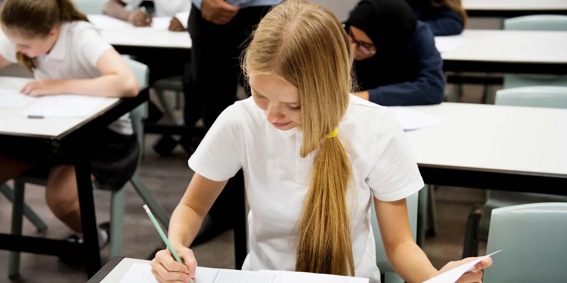 Students doing the exam in classroom