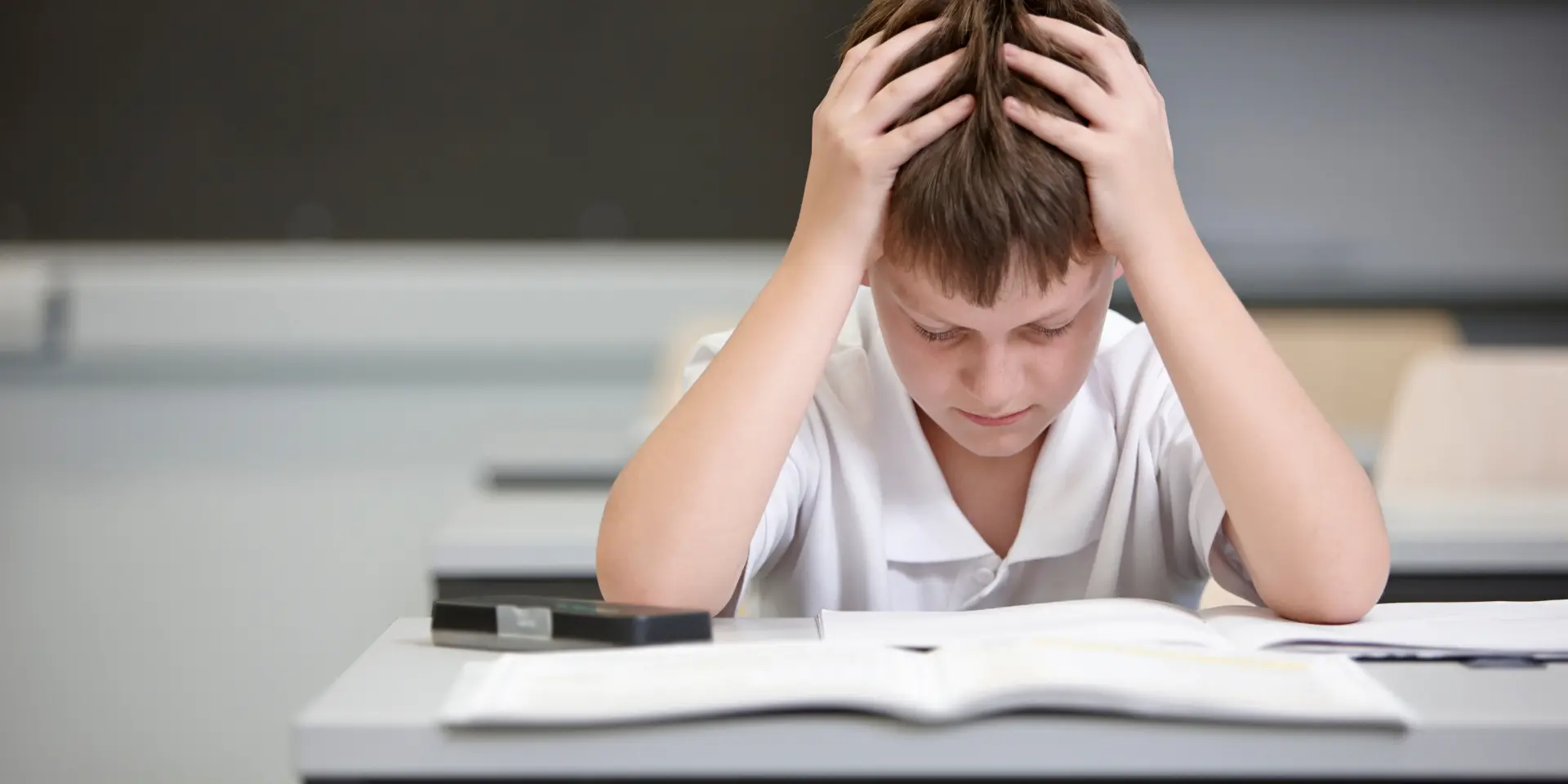 Schoolboy struggling in educational exam