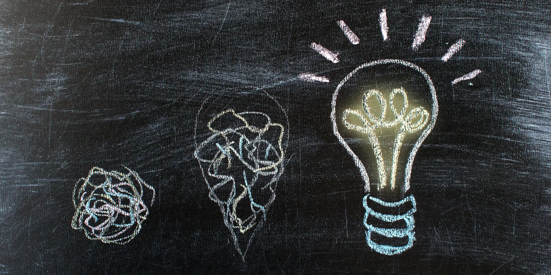 Chalkboard with Chalk Drawing of Hanging Light Bulb Bright idea on blackboard concept Way of