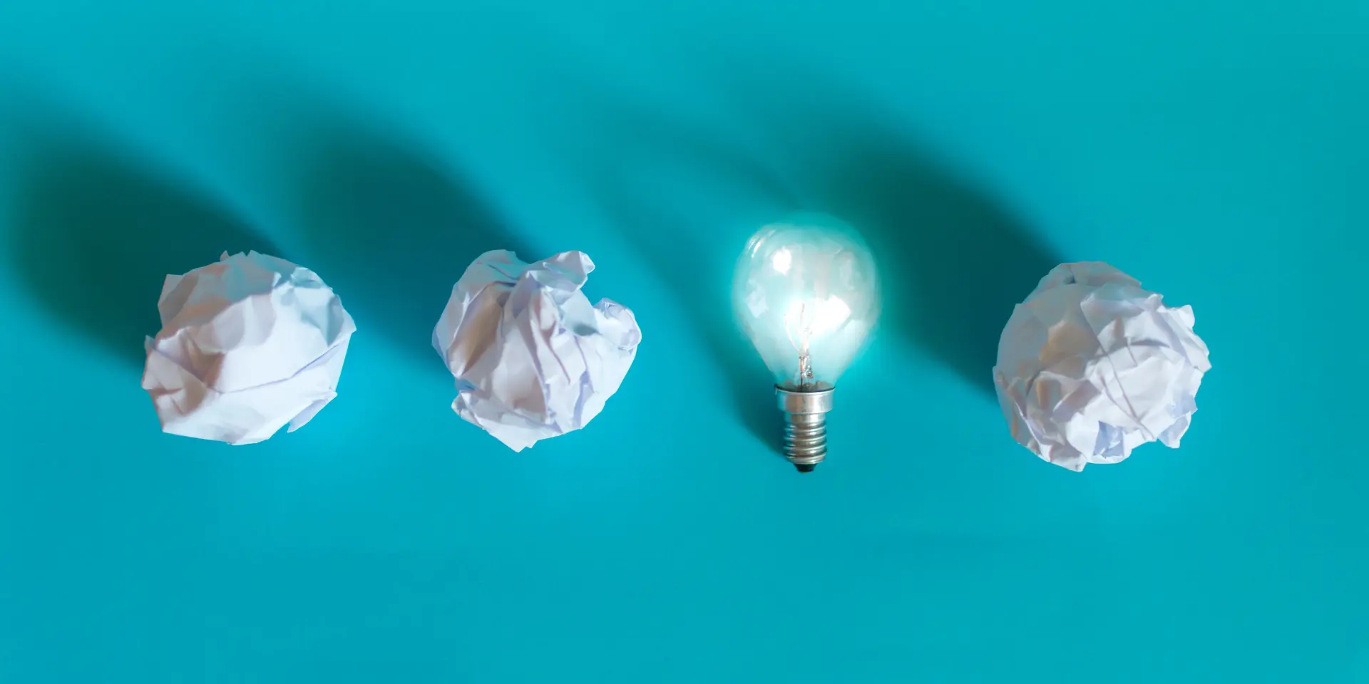 Concept of bright idea with paper and light bulbs