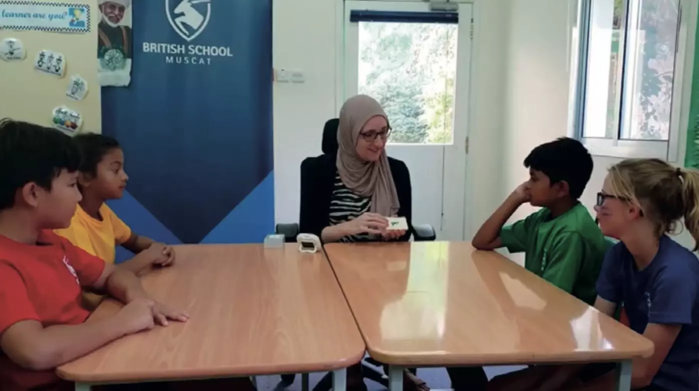 British School Muscat students using a Lexonik programme around a table