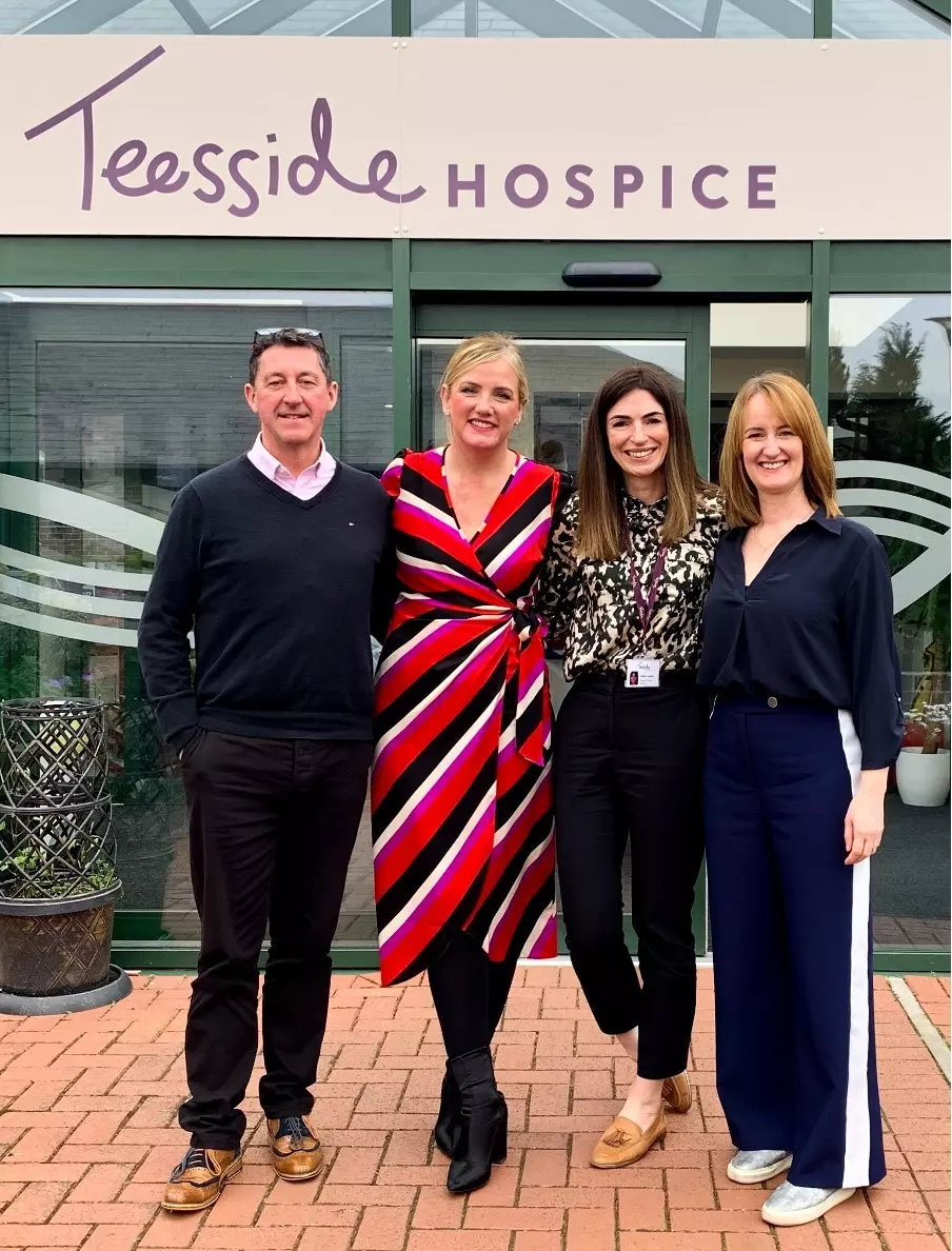 lexonik staff and a representative from tesside hospice pictured in front of teesside hospice headquarters