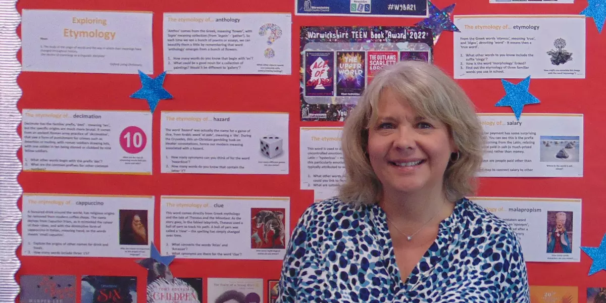 a teacher stood in front of a display at exhall grange school