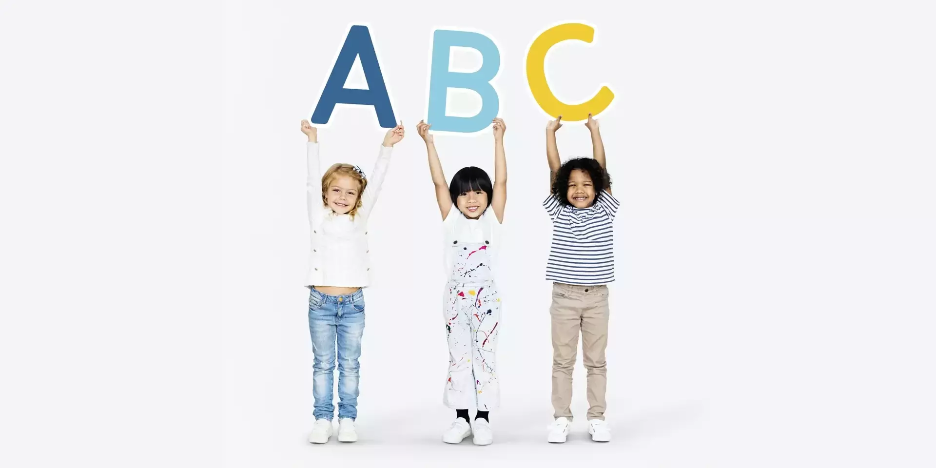 three children holding up the letters a b and c